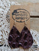 Dark brown leather earrings on a 'Western Border' branded card with lace background